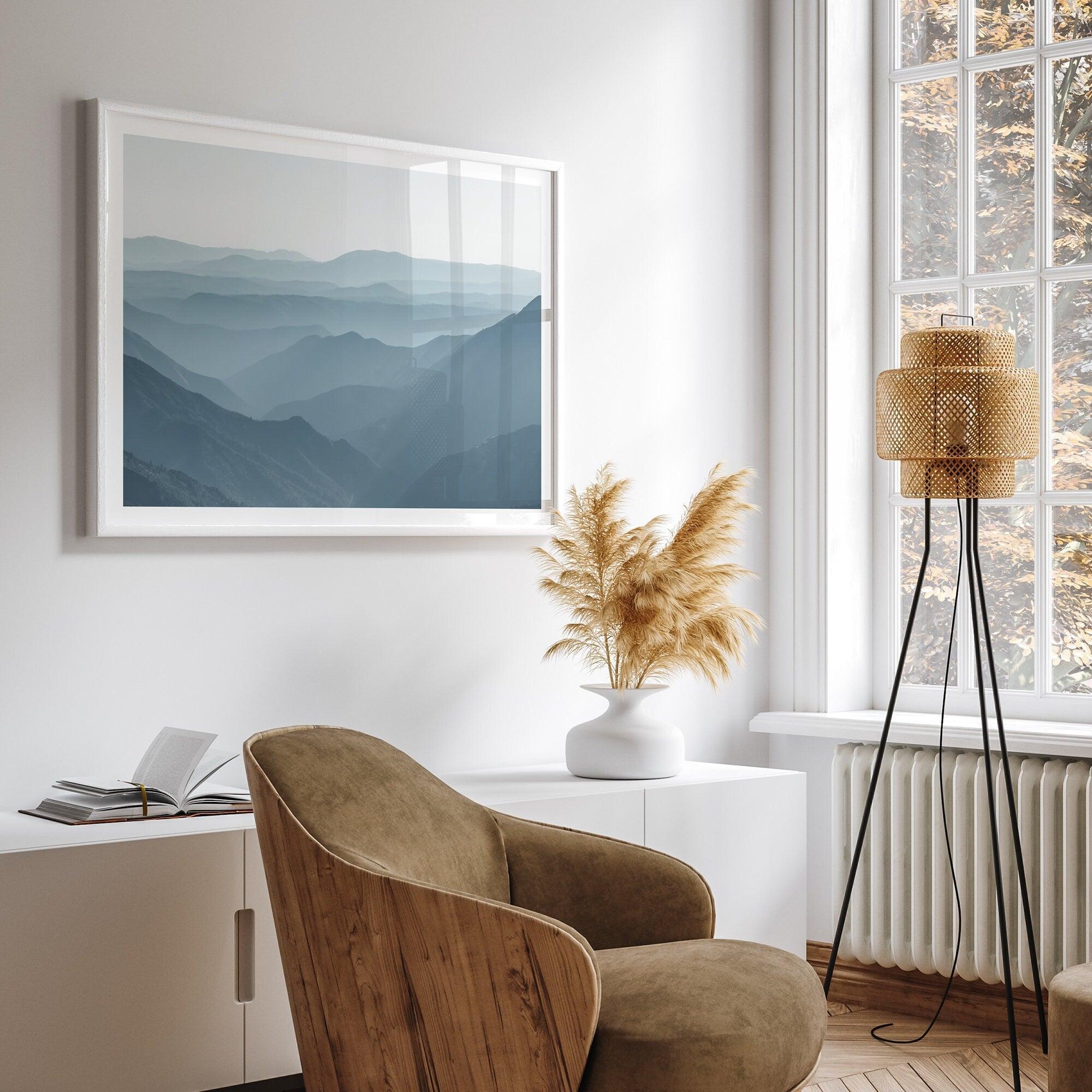 A fine art mountain photography print showing tens of shaded mountains one after the other. This minimalist mountain range wall art is perfect for nature lovers.