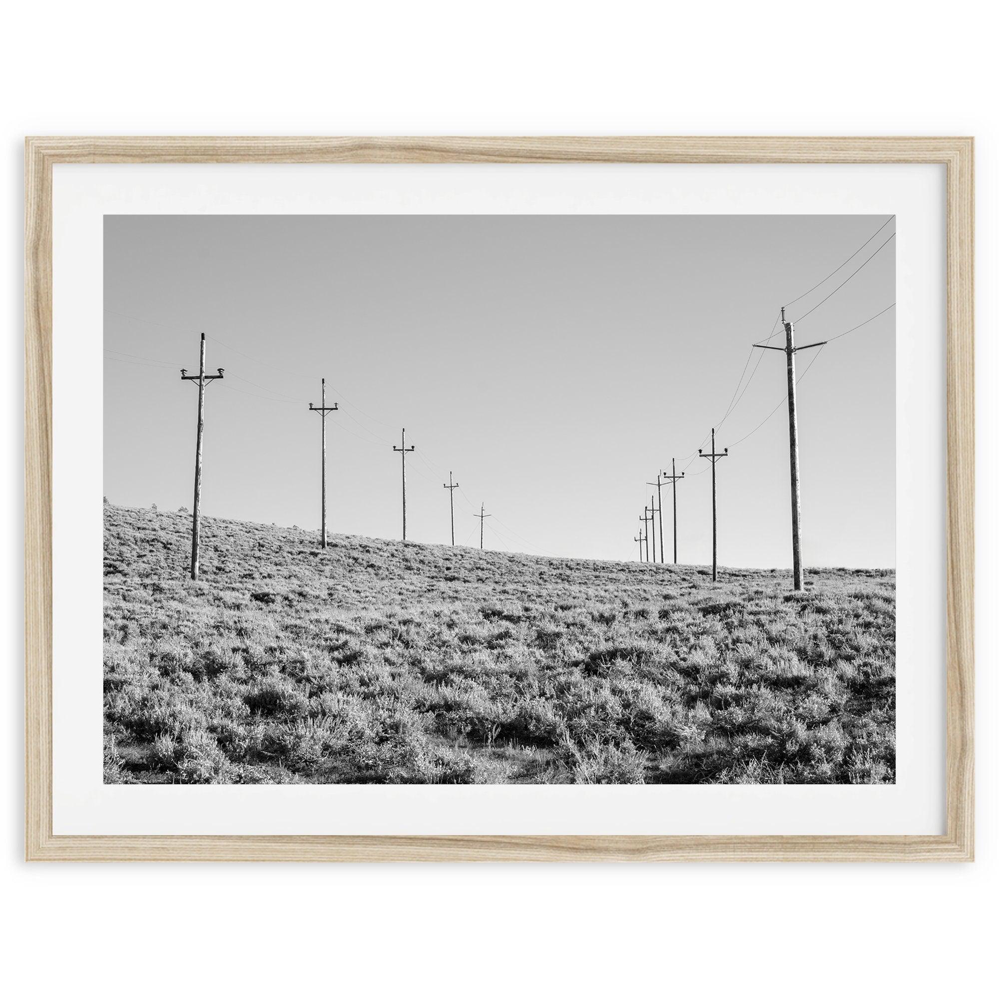 A black and white fine art photography print showcasing desert power lines in the Eastern Sierras in Americana decor style.