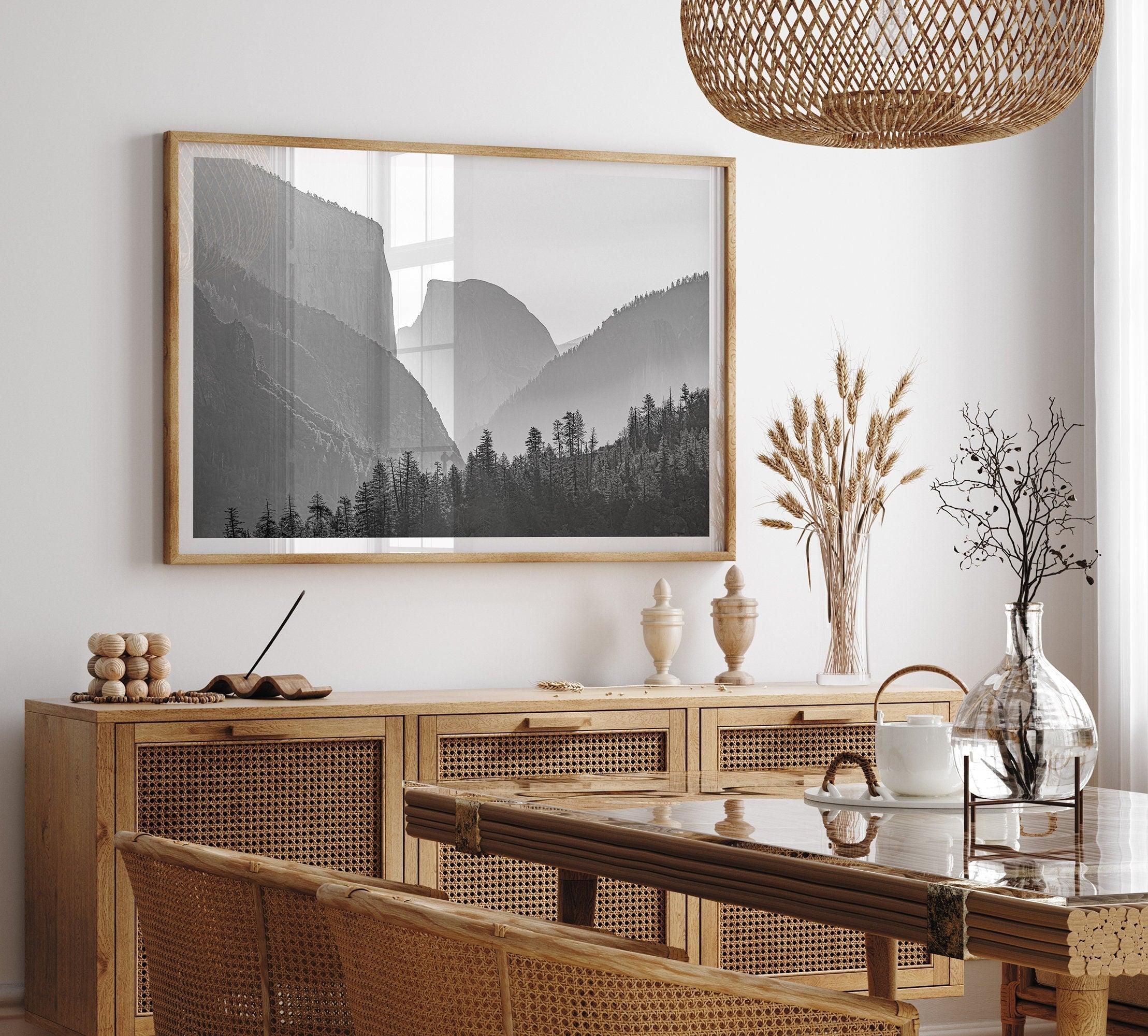 A black and white photography wall art of Yosemite Valley at sunset, featuring the iconic Half Dome and El Capitan bathed in dramatic light and shadow. Perfect for nature lovers and art enthusiasts.