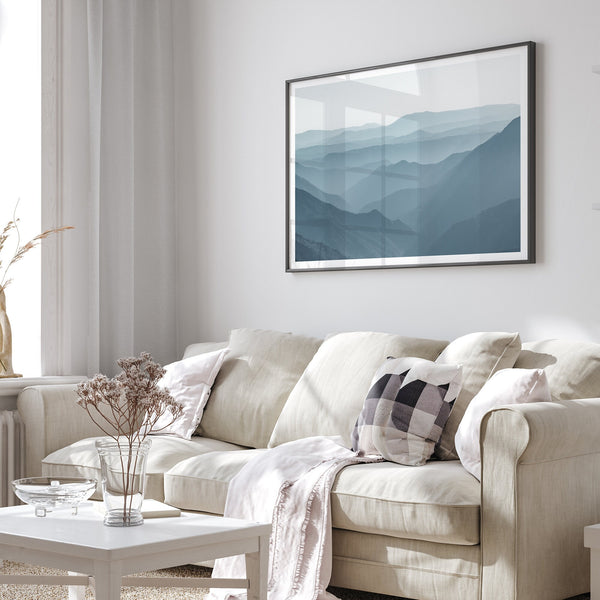 A fine art mountain photography print showing tens of shaded mountains one after the other. This minimalist mountain range wall art is perfect for nature lovers.