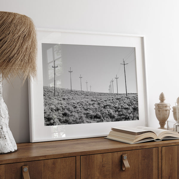 A black and white fine art photography print showcasing desert power lines in the Eastern Sierras in Americana decor style.