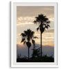 Palm tree wall art featuring two silhouetted palms at sunrise along a California beach.