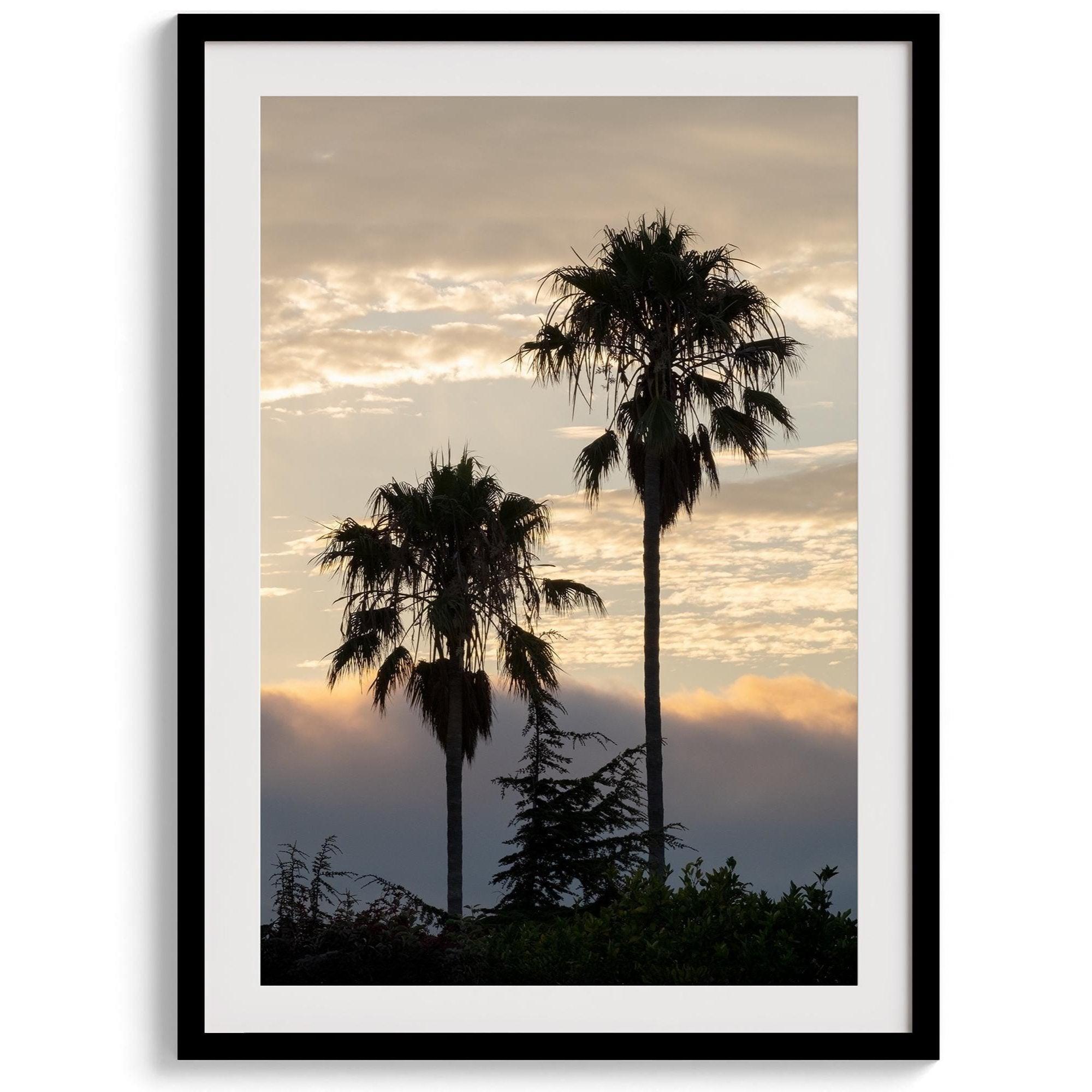 Palm tree wall art featuring two silhouetted palms at sunrise along a California beach.