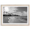 Black and white tropical wall art featuring a serene sunrise on a beach in Kauai, Hawaii with palm trees