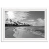 Black and white tropical wall art featuring a serene sunrise on a beach in Kauai, Hawaii with palm trees