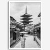 Timeless Kyoto scene with traditional architecture and kimono-clad woman in black and white.