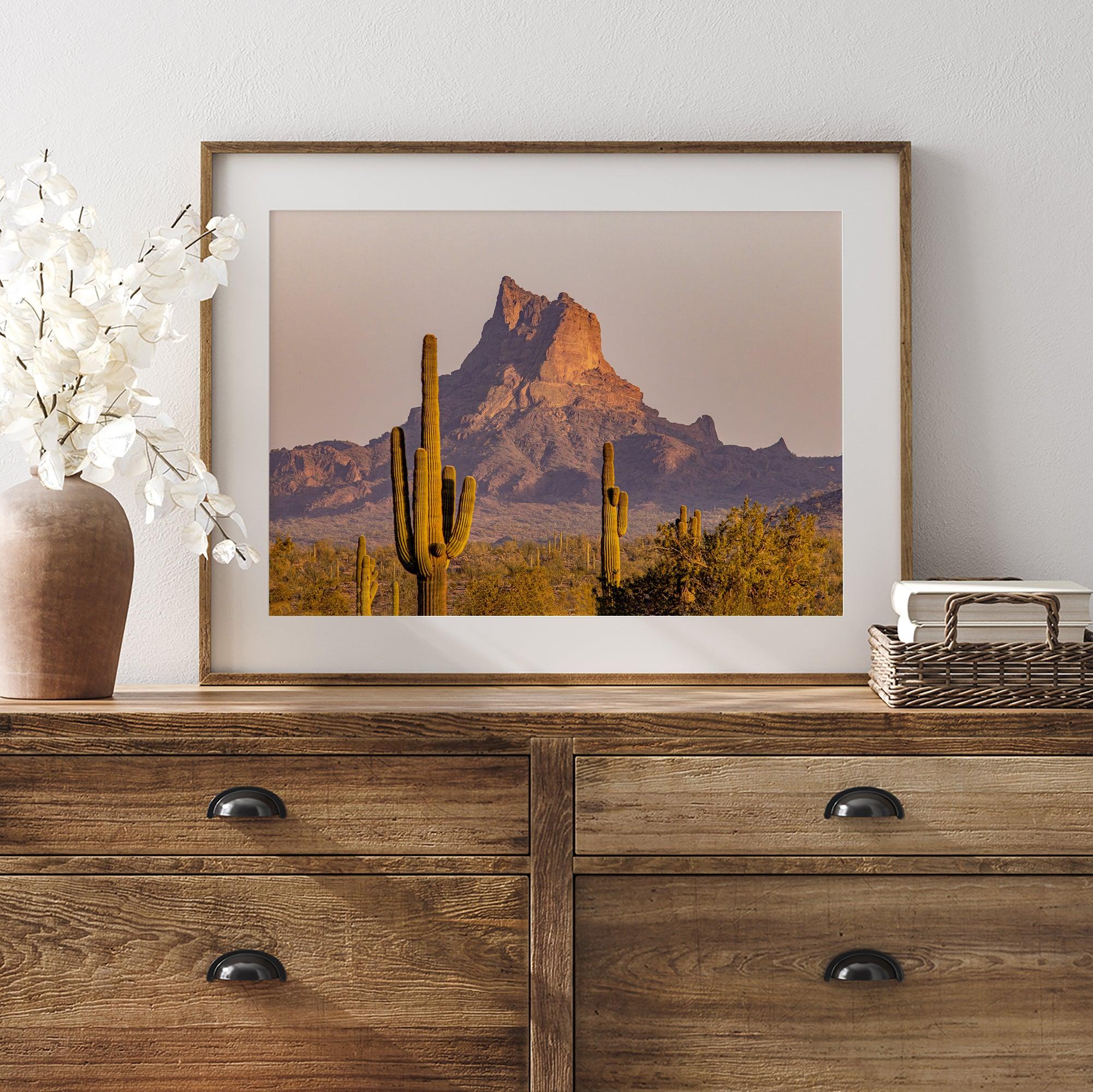 Framed photography print of an Arizona desert landscape with saguaro cacti and a sunlit mountain.