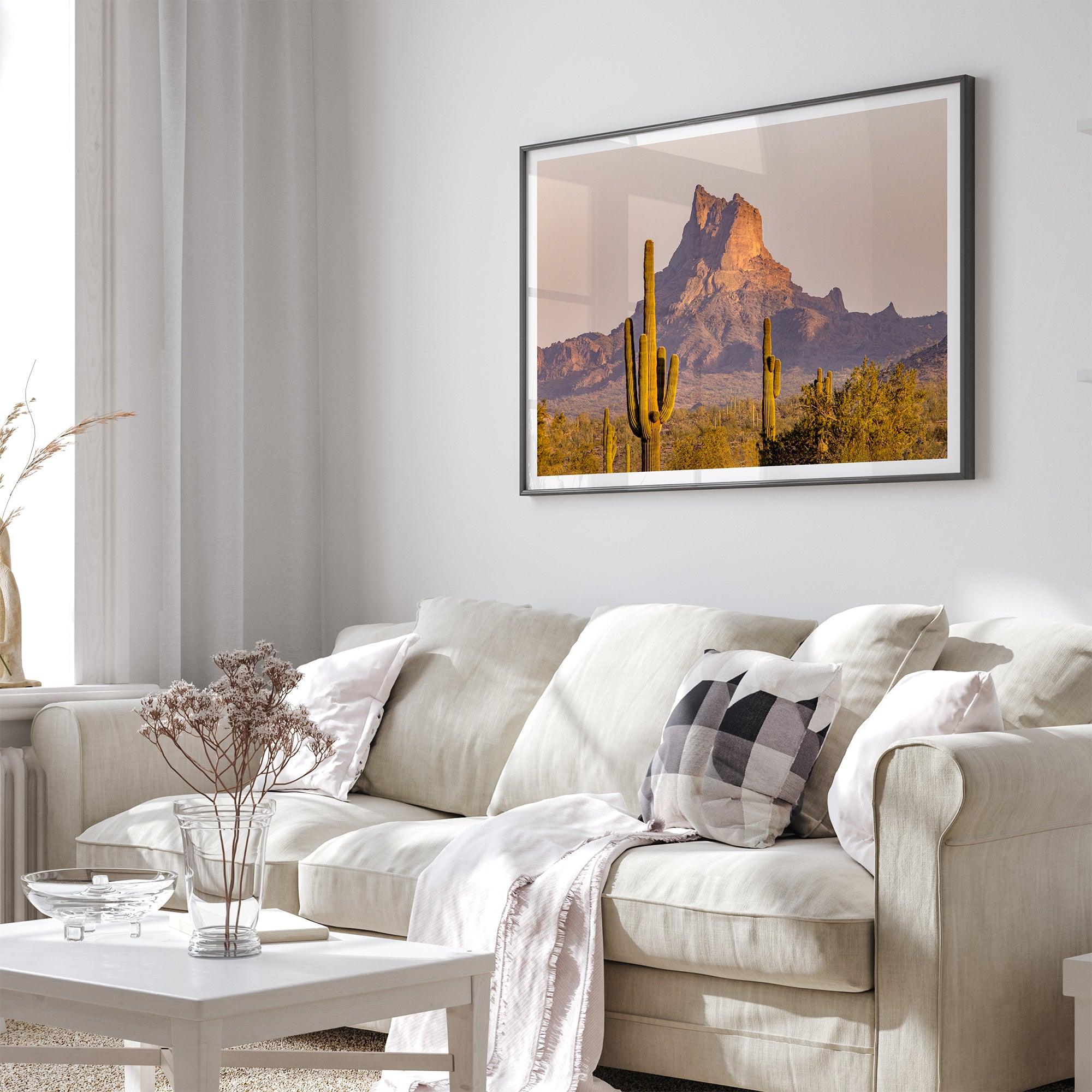 Framed photography print of an Arizona desert landscape with saguaro cacti and a sunlit mountain.