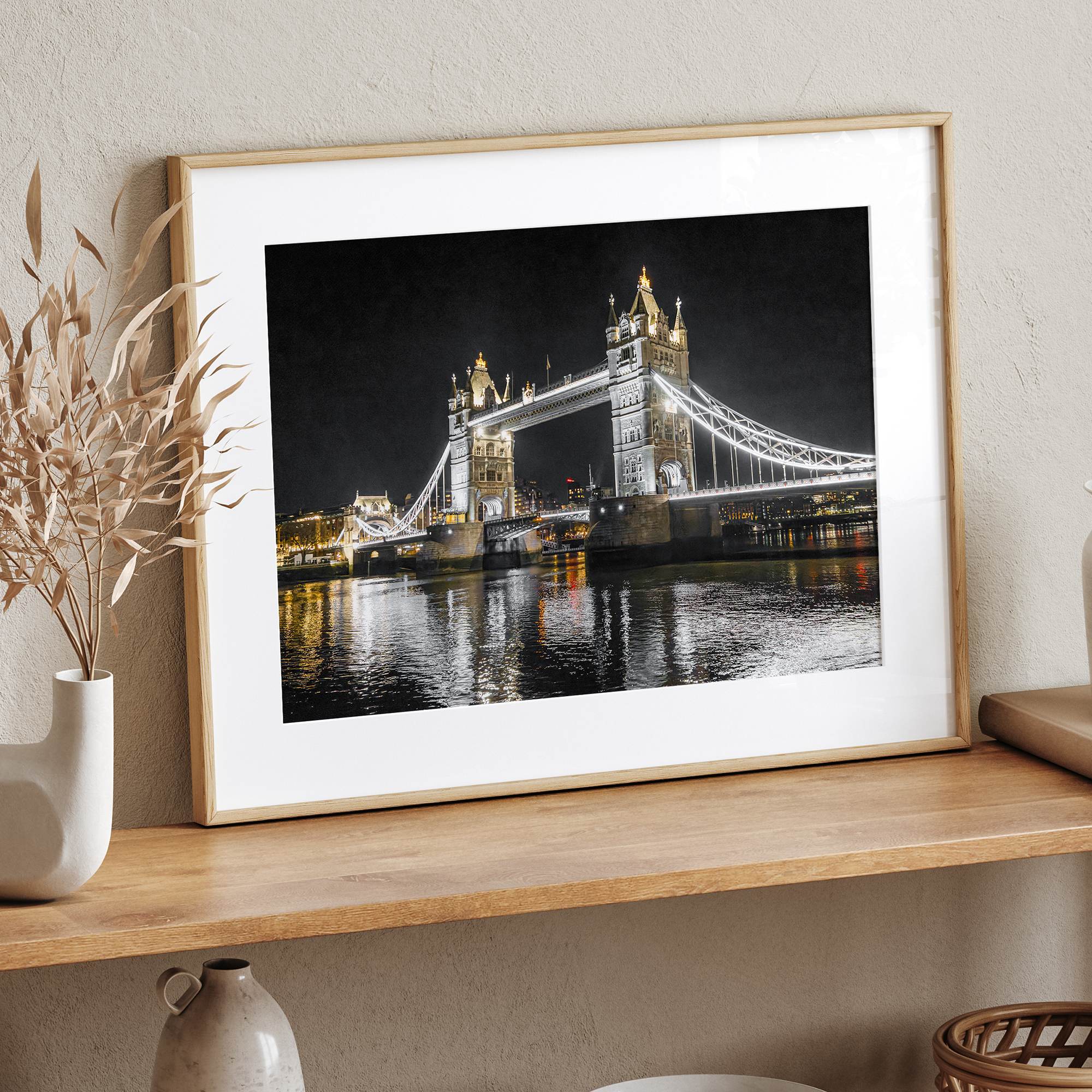 Night view of London’s Tower Bridge with glowing lights and water reflections, perfect london wall art print