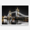 Night view of London’s Tower Bridge with glowing lights and water reflections, perfect london wall art print