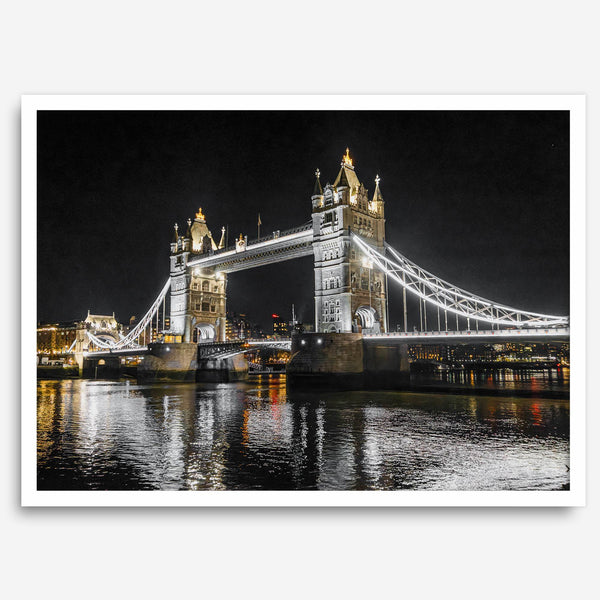 Night view of London’s Tower Bridge with glowing lights and water reflections, perfect london wall art print