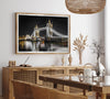 Night view of London’s Tower Bridge with glowing lights and water reflections, perfect london wall art print