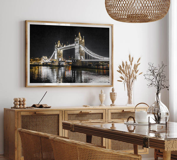 Night view of London’s Tower Bridge with glowing lights and water reflections, perfect london wall art print