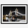Night view of London’s Tower Bridge with glowing lights and water reflections, perfect london wall art print