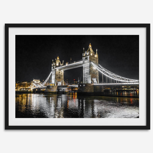Night view of London’s Tower Bridge with glowing lights and water reflections, perfect london wall art print
