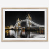 Night view of London’s Tower Bridge with glowing lights and water reflections, perfect london wall art print
