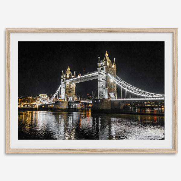 Night view of London’s Tower Bridge with glowing lights and water reflections, perfect london wall art print