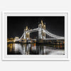 Night view of London’s Tower Bridge with glowing lights and water reflections, perfect london wall art print