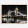 Night view of London’s Tower Bridge with glowing lights and water reflections, perfect london wall art print