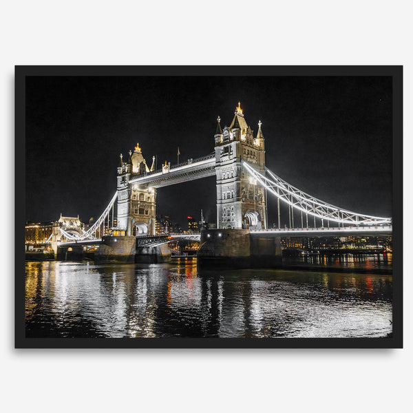 Night view of London’s Tower Bridge with glowing lights and water reflections, perfect london wall art print