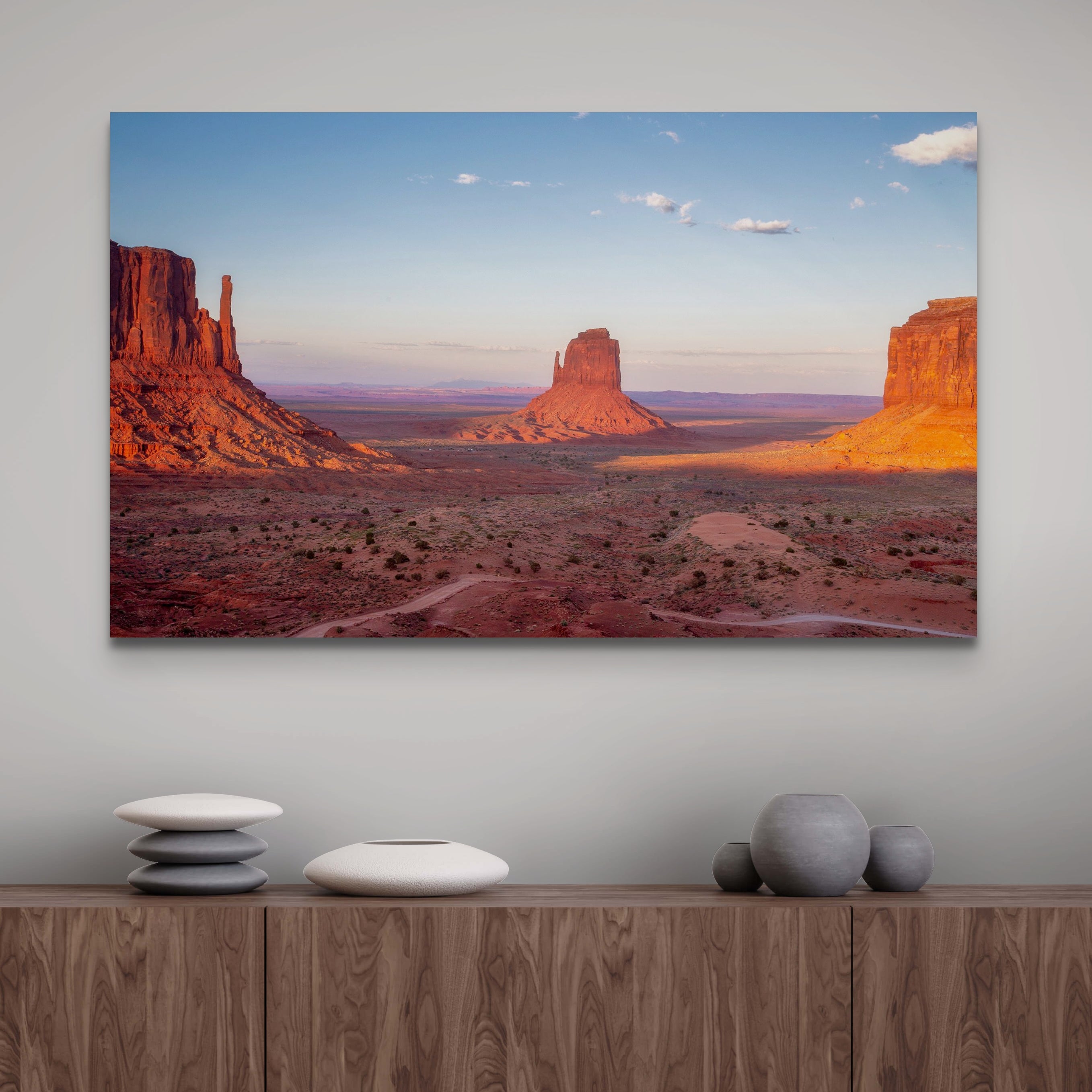 Monument Valley desert landscape print with towering sandstone buttes and a vibrant sunset sky, available as framed or canvas wall art.