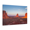 Monument Valley desert landscape print with towering sandstone buttes and a vibrant sunset sky, available as framed or canvas wall art.