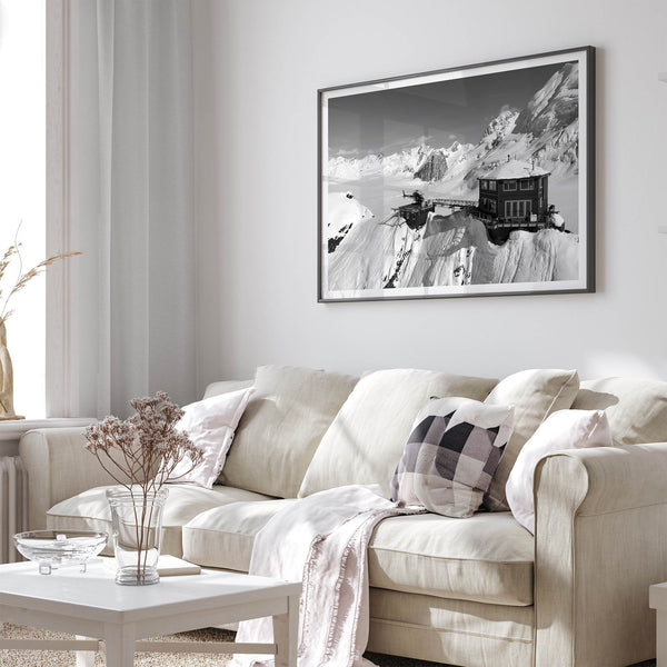 Black and white mountain cabin wall art with helicopter over snowy Denali peaks, Alaska winter landscape photography print.