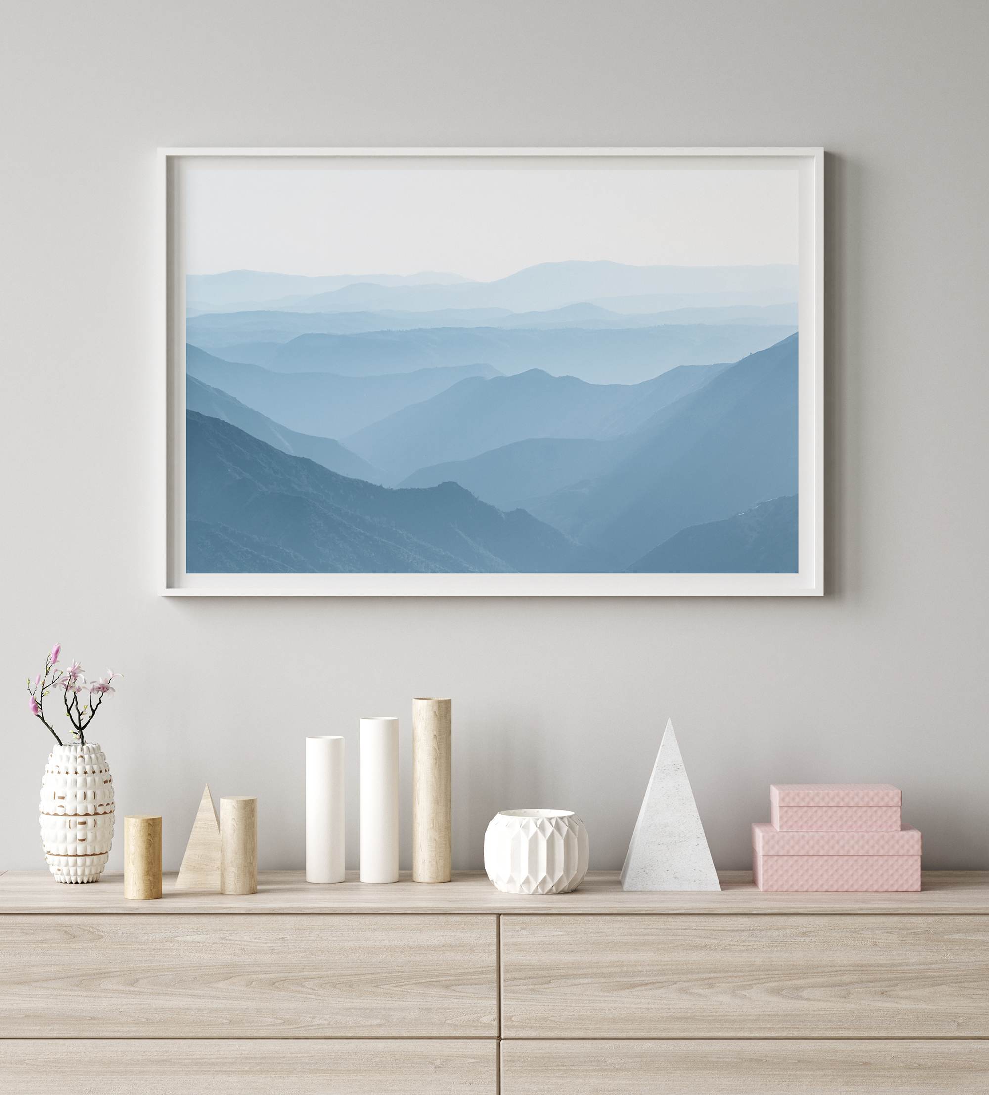 A fine art mountain photography print showing tens of shaded mountains one after the other. This minimalist mountain range wall art is perfect for nature lovers.