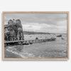 Scenic Pacific Northwest wall art of Trinidad State Park in California in black and white, showcasing a coastal pier, lush green cliffs, and calm ocean waves under cloudy skies.