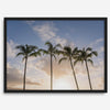 Palm tree artwork that shows a sunset over palm trees in Kauai with golden sky and tropical landscape for wall decor.