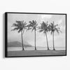 Black and white canvas print of four tall palm trees on Hanalei Bay beach in Kauai, with mountains and cloudy sky in the background.