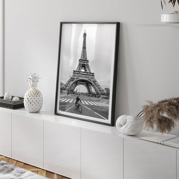 Black-and-white Eiffel Tower photo with a cyclist in the foreground, perfect for Paris wall art decor.