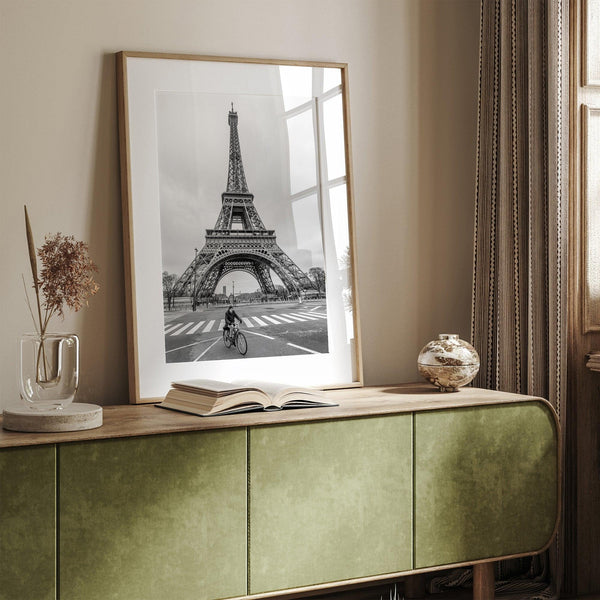 Black-and-white Eiffel Tower photo with a cyclist in the foreground, perfect for Paris wall art decor.