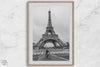 Black-and-white Eiffel Tower photo with a cyclist in the foreground, perfect for Paris wall art decor.