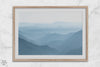 A fine art mountain photography print showing tens of shaded mountains one after the other. This minimalist mountain range wall art is perfect for nature lovers.