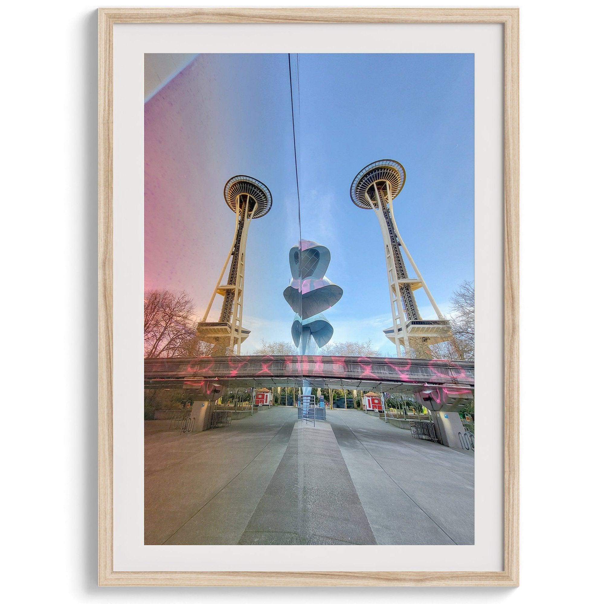 Seattle wall art featuring Space Needle reflected on Museum of Pop Culture walls with pink and blue tones.