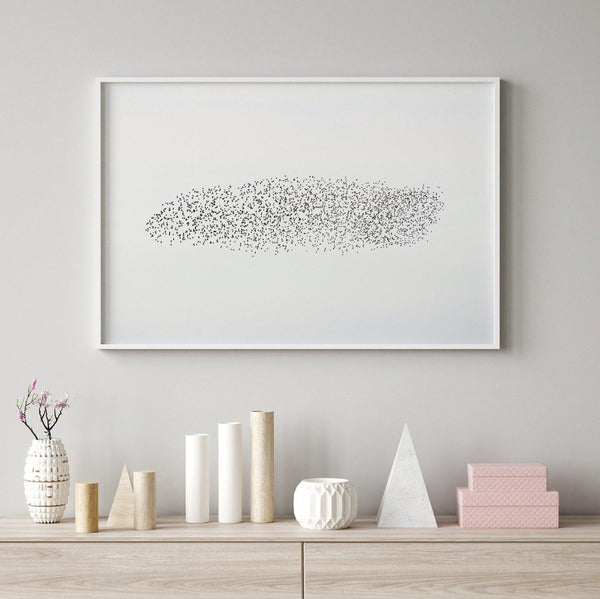 An abstract nature photography landscape photography print featuring a murmuration of starlings in an abstract formation against the sky, capturing minimalist beauty.