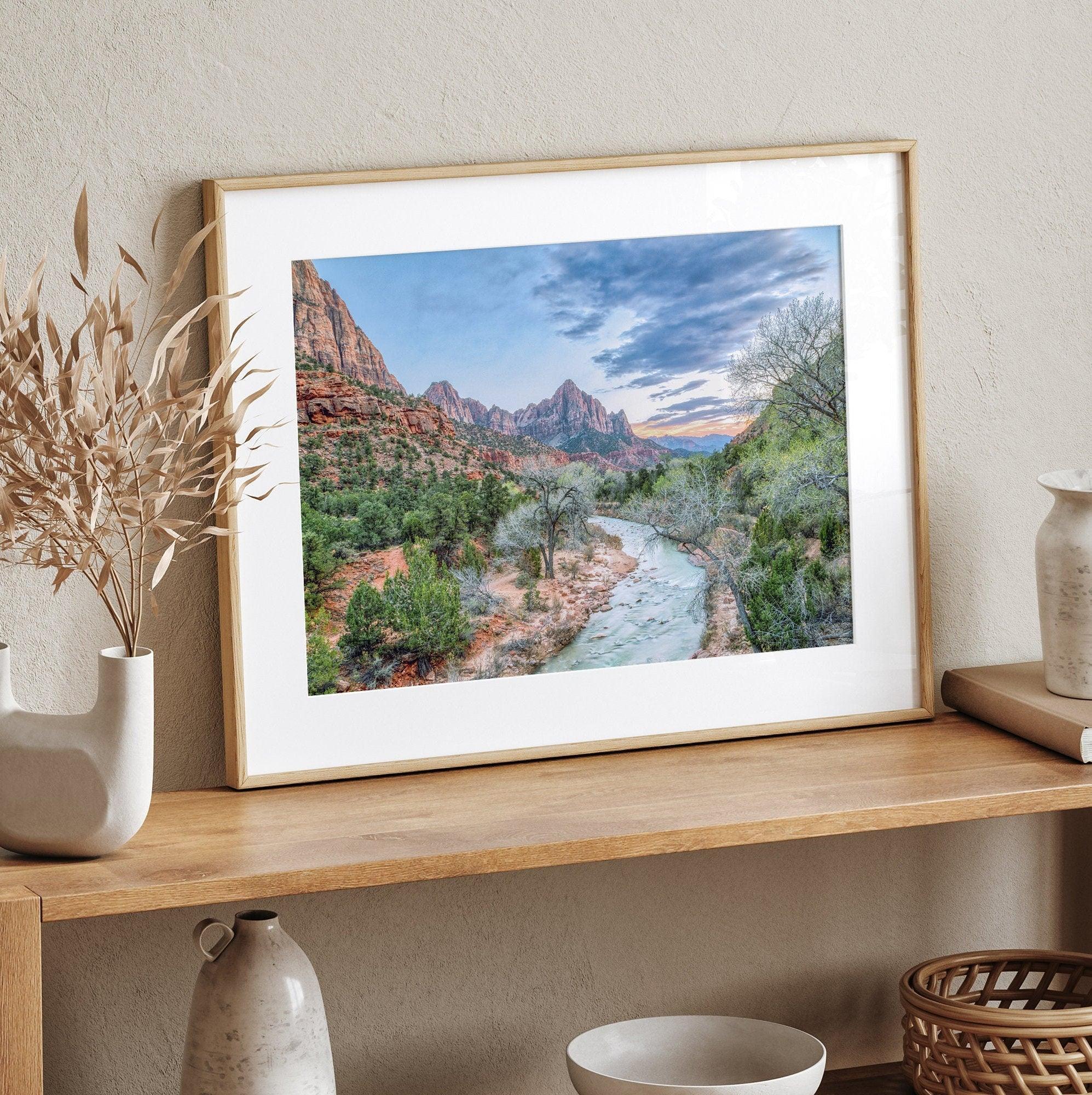 A framed fine art landscape photography print of Zion National Park showing a beautiful river, trees, and desert landscape with the backdrop of Zion mountain range. This Utah wall art is perfect for nature photography and desert art enthusiasts.