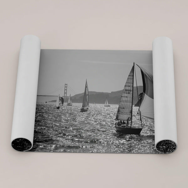 A fine art black and white framed or unframed print of the sailboats in the San Francisco Bay with the backdrop of the Golden Gate Bridge.