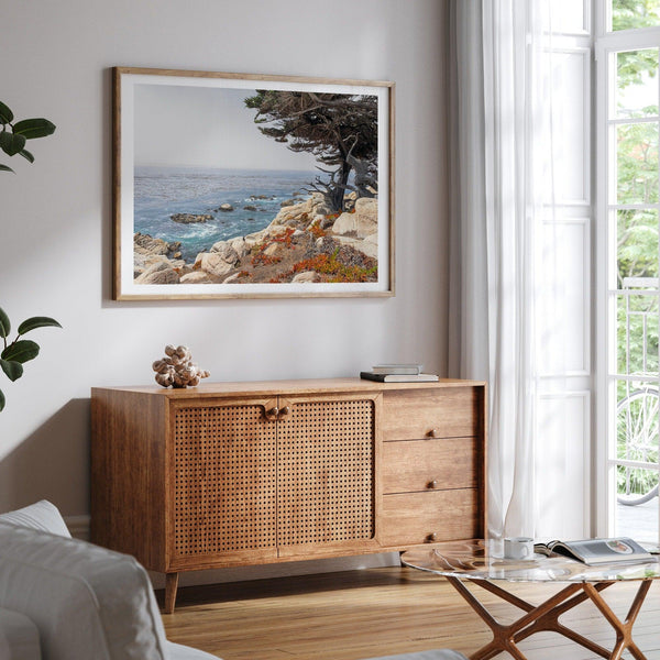 This stunning piece of art captures the beauty and drama of California&#39;s rugged coastline. This large framed or unframed ocean wall art showcases a large coastal tree overlooking the ocean near Monterey on Route 1.