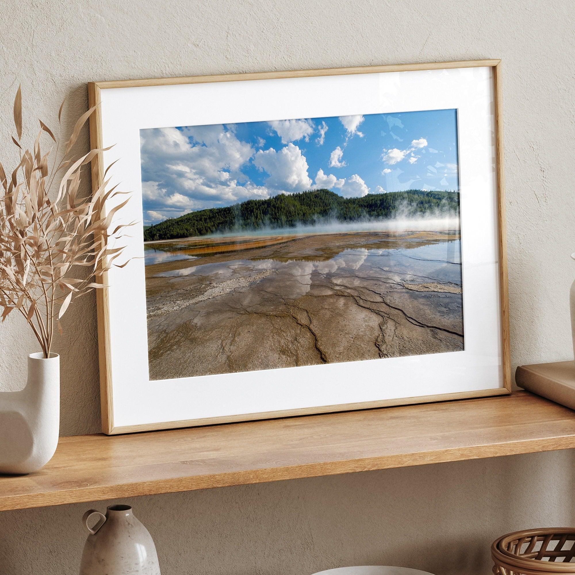 A fine art framed or unframed print of the stunning Grant Prismatic hot springs in Yellowstone National Park. This nature wall art showcases the beautiful geometrical shapes and cloud reflections in the hot spring water.