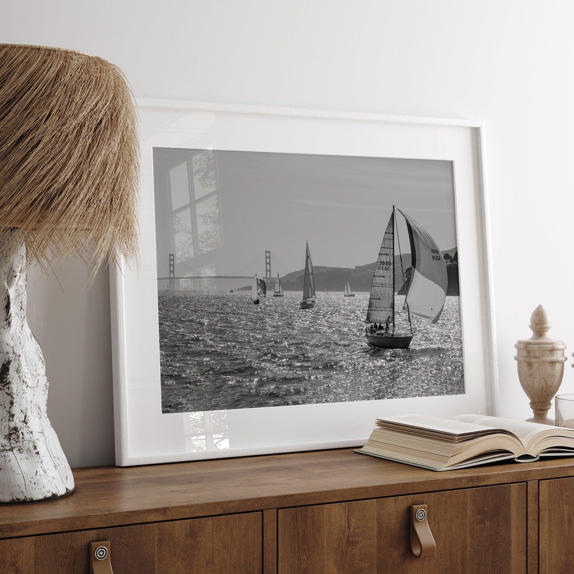 A fine art black and white framed or unframed print of the sailboats in the San Francisco Bay with the backdrop of the Golden Gate Bridge.