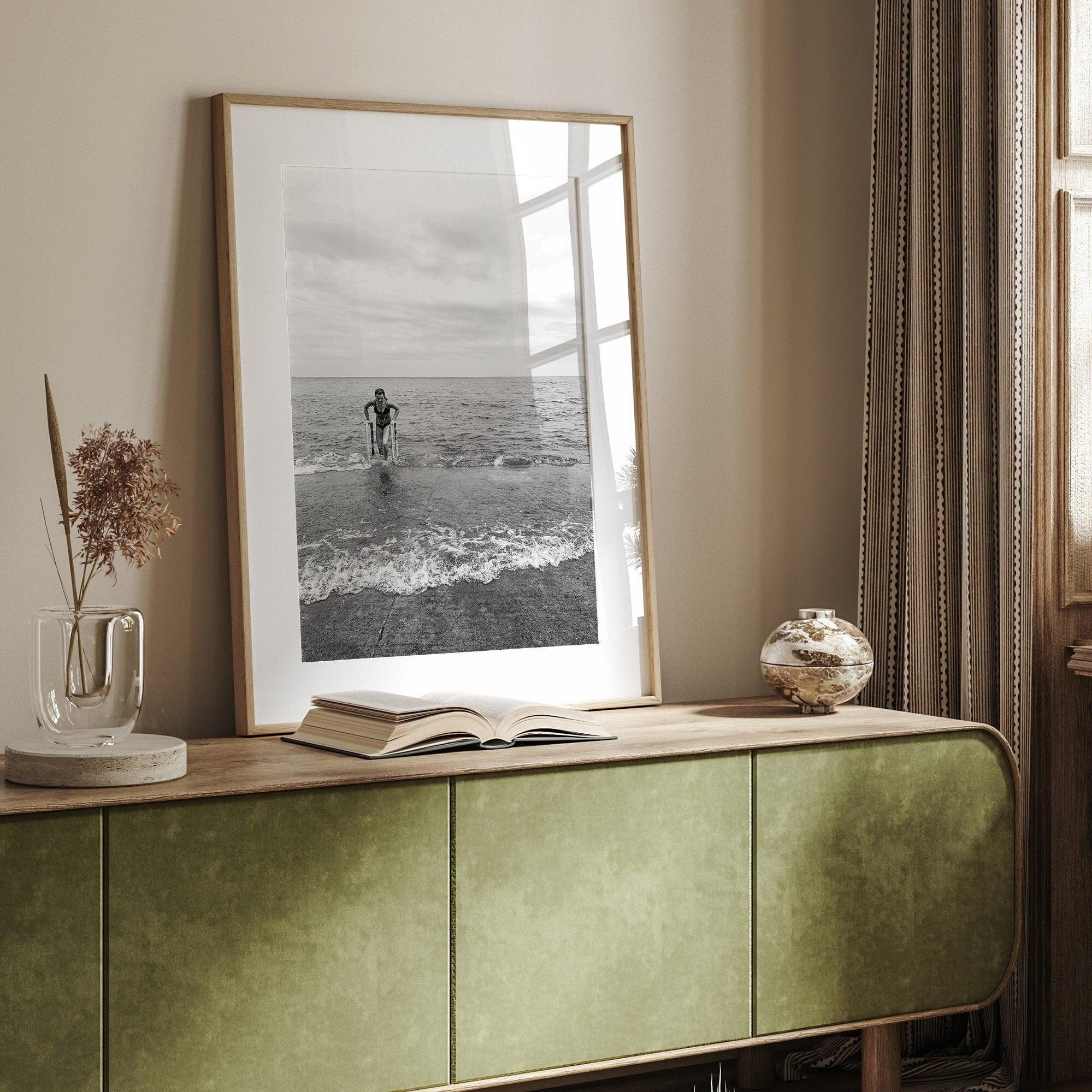 A black and white fine art lake beach print of a beach in Chicago on the coast of Lake Michigan showcasing a woman bathing in the lake. The classic modern look of the print is sure to impress when hung on your walls.