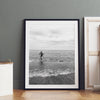 A black and white fine art lake beach print of a beach in Chicago on the coast of Lake Michigan showcasing a woman bathing in the lake. The classic modern look of the print is sure to impress when hung on your walls.