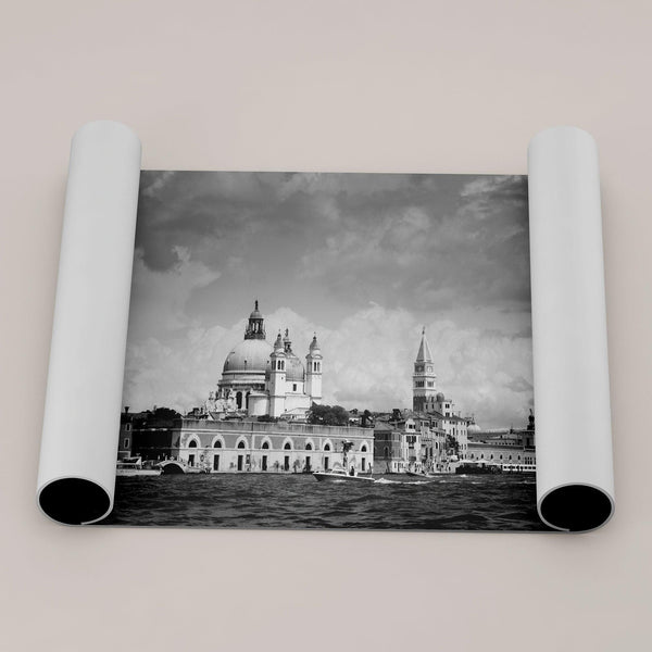 This framed black and white Venice print showcases the iconic Basilica di Santa Maria della Salute and St Mark Square taken from the canal. The clouds add a dramatic effect and create a classic look to this breathtaking Italian wall art.