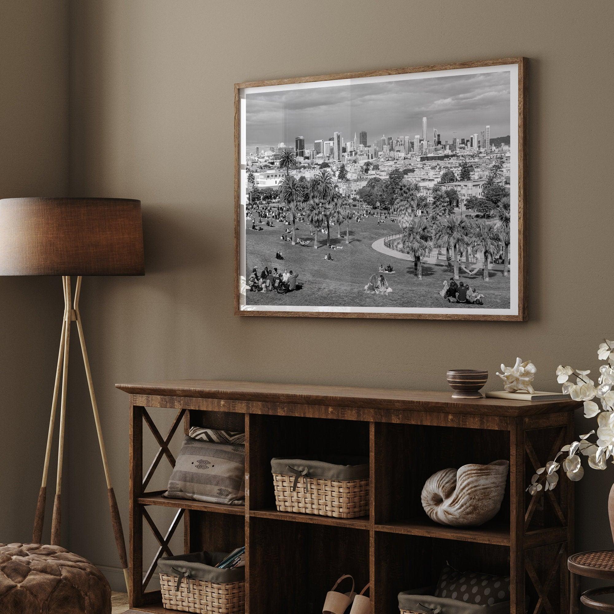 Black and white fine art print of Mission Dolores Park in San Francisco showcasing picnic blankets and people enjoying a quiet afternoon with the city skyline in the backdrop.