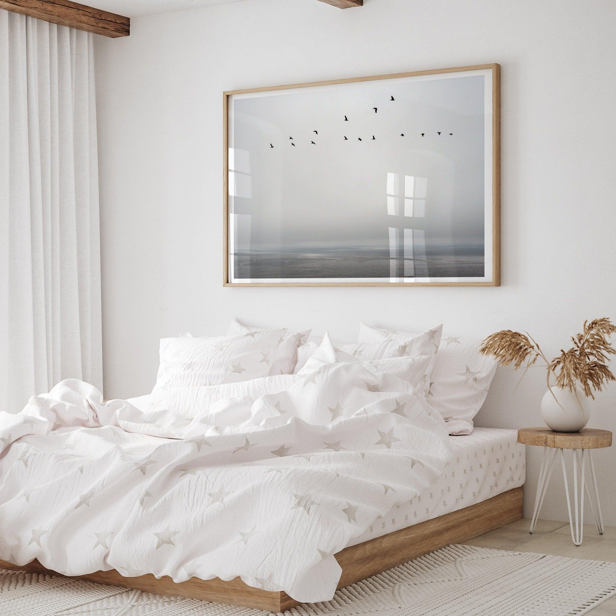 This fine art minimalist ocean print showcases pelicans flying across the Pacific Ocean in Pacifica, California.