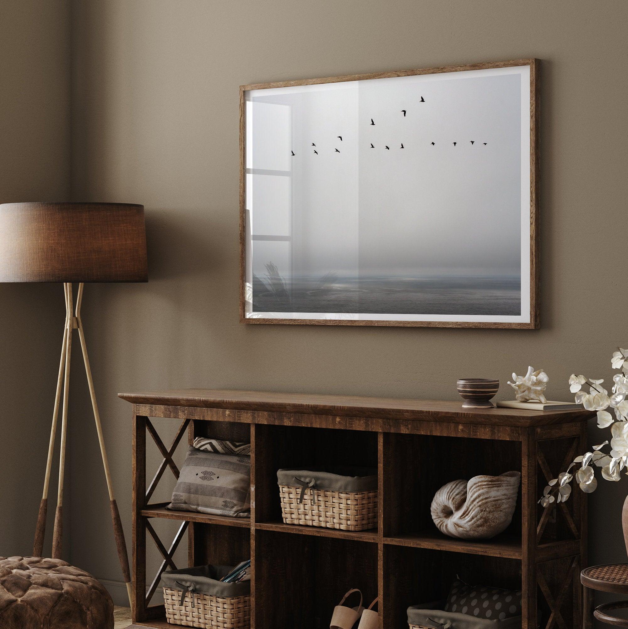 This fine art minimalist ocean print showcases pelicans flying across the Pacific Ocean in Pacifica, California.