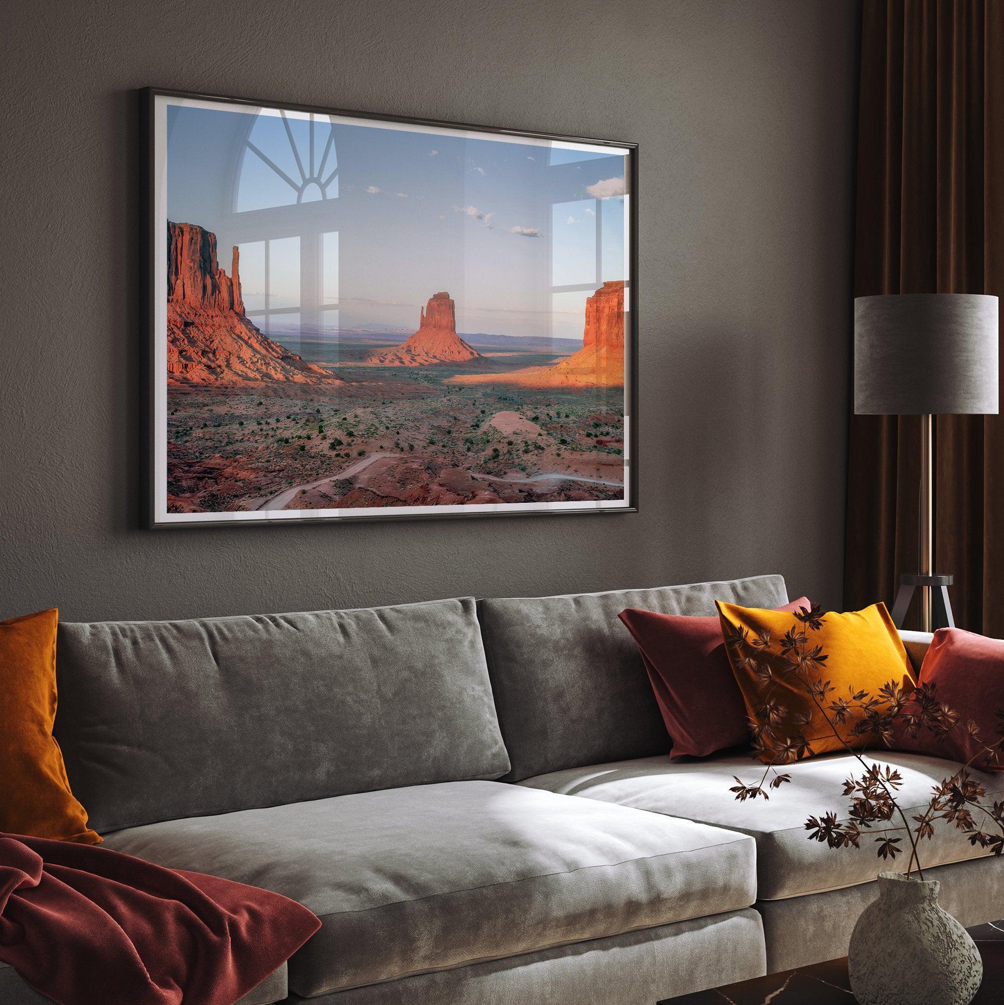 A fine art landscape photography print of a desert sunset over Monument Valley, located on the Arizona-Utah border. The warm and vibrant hues of this American Southwest sunset create a mesmerizing and awe-inspiring scene.