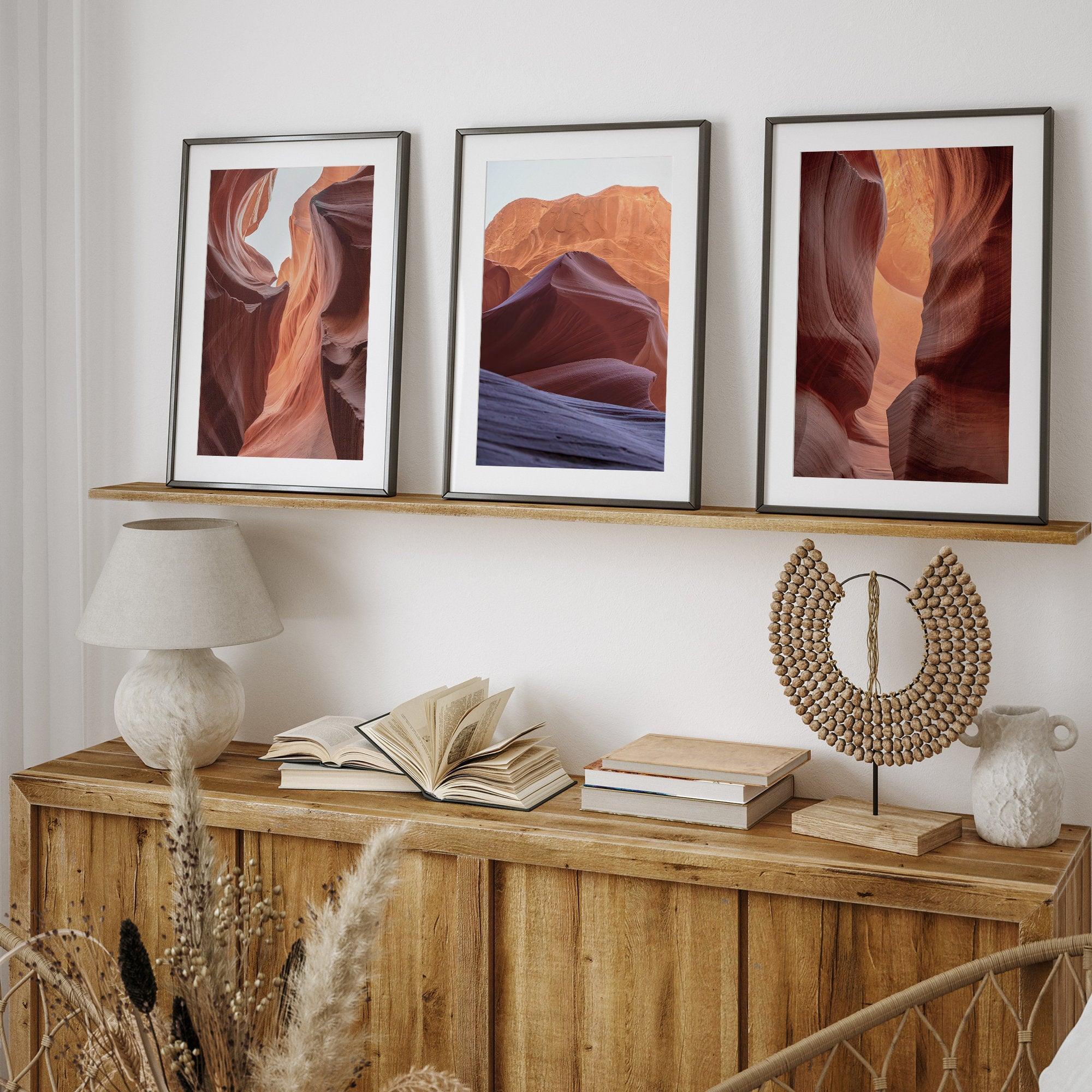 A set of 3 wall art framed or unframed prints of antelope canyon. Each print in this gallery wall set shows a different scene from the stunning canyon with its unique colors and textures.